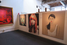 Load image into Gallery viewer, Virut Panchabuse Red Lollipop gal with glasses, vibrant mixed media portrait on red background.